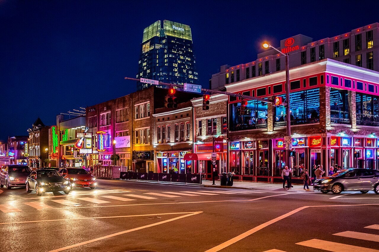 Neon-lit honky-tonks along Broadway in downtown Nashville at night